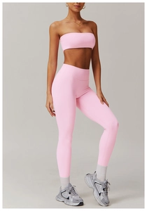 Detail of pink two-piece yoga set with sports bra and high-waisted seamless leggings