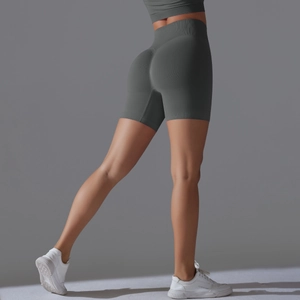Close-up of high-waisted seamless yoga shorts in dark grey with ribbed fabric texture