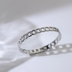 Detailed view of silver chain-link stainless steel bracelet with a sleek punk finish