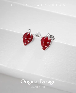 Detailed macro of S925 sterling silver strawberry earrings with 925 certification stamp