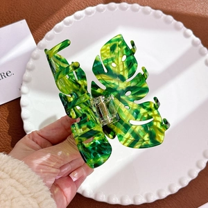 Large monstera leaf hair claw clip with green marble acetate and gold spring detail