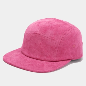 Detail view of pink suede 5-panel cap featuring matte finish and breathable eyelets