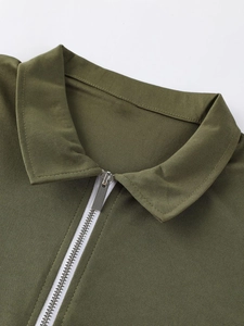 Army green men's polo shirt with half-zip collar and durable twill fabric texture