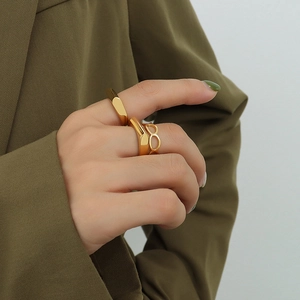 Three-piece gold minimalist geometric rings including signet and hollow band set for women