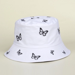 Detail of embroidered black butterflies on a white cotton bucket hat for women