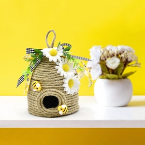 Handmade hemp rope bee hive pendant with daisies and bees on a vibrant yellow backdrop