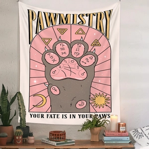 Detail of Pawmistry cat paw tapestry with astrological symbols on white wall