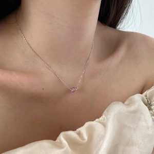 Close-up of elegant S925 silver necklace featuring a pink pear-shaped heart zircon pendant