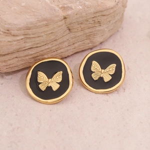 Boucles d'oreilles vintage papillon doré sur émail noir avec une finition métal raffinée