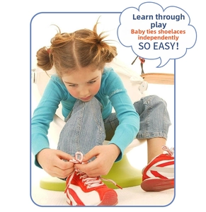 Toddler learning to lace colorful wooden preschool shoes for fine motor skill practice