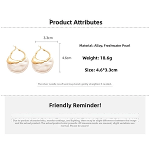 Detail view of large baroque pearl earrings with dimensions 4.6cm x 3.3cm on white background