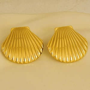 Detailed view of 18k gold plated shell stud earrings with a glossy metal finish