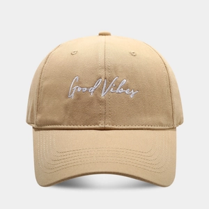 Khaki cotton baseball cap with Good Vibes embroidery and curved brim in 45-degree view