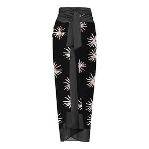 Black wrap sarong skirt with white and lavender starburst prints and a waist tie