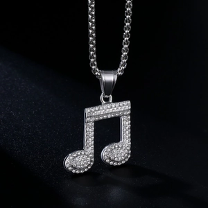 Fashionable silver music note pendant necklace with sparkling rhinestones in a macro shot