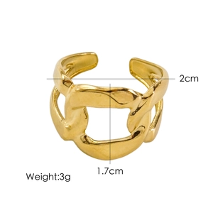 Macro detail of 14K gold-plated irregular chain ring with lava texture and 2cm width