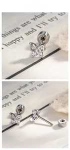 Macro view of dainty hollow butterfly cartilage studs with zircon inlay and back details