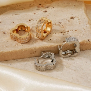 Exquisite clover stud earrings in gold and silver set with micro-pave white zircons