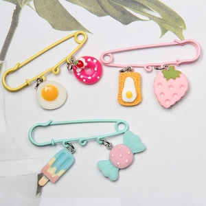 Candy colored 6cm safety pins with resin food charms including donut and strawberry