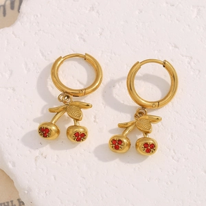 Macro view of 18K gold plated cherry earrings with shimmering red rhinestones