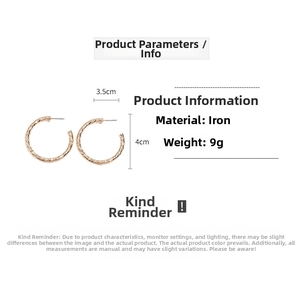 Detail showing 4cm diameter gold C-shaped textured earrings with material specifications