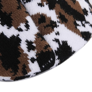 Macro shot of the soft knitted leopard pattern fabric showing high-quality wool texture
