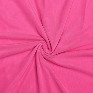 Close-up of pink mesh fabric detailing with elegant swirl pleats and textured patterns