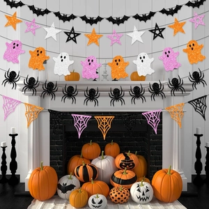 Detailed view of layered glitter paper Halloween banners with ghost and spider patterns