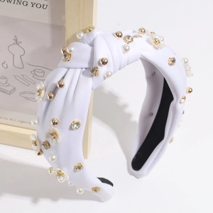 Detail of white twisted headband with pearls, rhinestones and 3D resin flowers