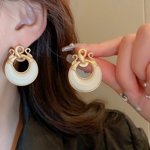 Vintage gold geometric earrings with white resin inlay and elegant knot design for women