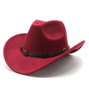 Detail of wine red felt cowboy hat featuring brown leather band and bronze buckles