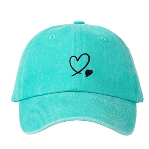 Mint green baseball cap with black heart embroidery in minimalist cotton twill style
