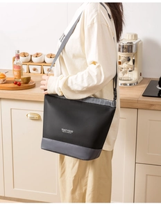 Detailed view of the large insulated lunch bag worn on shoulder for picnic and travel