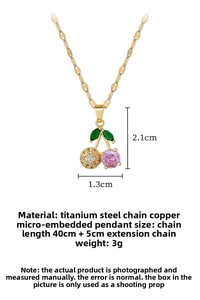 Macro view of cherry pendant necklace with dimensions and pink stone details