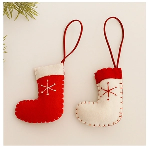 Close-up of knit Christmas socks with snowflake embroidery and hanging loops