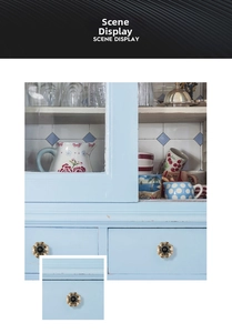 Macro detail of pumpkin shaped ceramic knob on vintage blue drawer with flower pattern