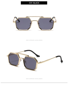 Close-up of polygon punk style sunglasses with gold metal frame and dark gray lenses
