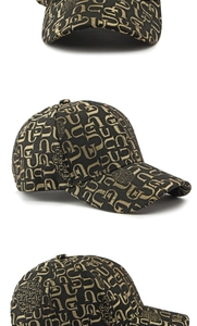 Detail view of black baseball cap with premium gold letter jacquard and curved brim