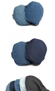 Detail der klassischen Schiebermütze aus gewaschenem Denim mit verstellbarer Metallschnalle