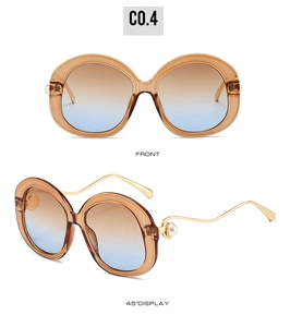 Front and 45-degree views of round amber sunglasses with large pearl temple accents
