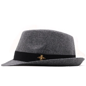 Classic dark grey wool fedora hat with black ribbon and gold bee emblem for men and women