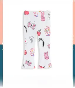 Detail of girls white flared leggings featuring colorful cartoon bunny and floral prints