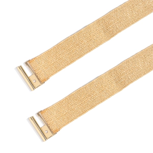 Close-up of woven straw belts featuring polished rectangular gold-toned metal buckles