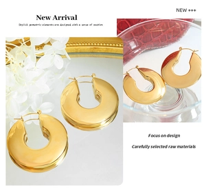 Detailed view of chunky U-shaped 18K gold plated stainless steel hoop earrings for women