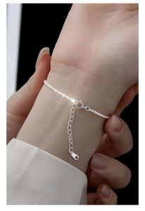 Detailed view of adjustable S925 sterling silver minimalist shimmering thin chain bracelet