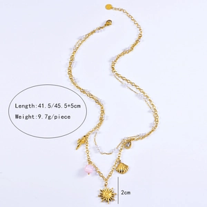 Detail showing dimensions of starfish and shell pendants on gold double-layer necklace