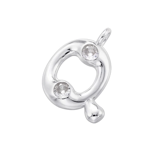 Macro shot of silver metal letter Q pendant featuring two sparkling round cubic zirconia stones