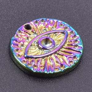 Detailed view of iridescent evil eye pendant with 18k gold plating and radial texture