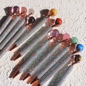 Glittery metal ballpoint pens with natural crystal stones and rose gold accents