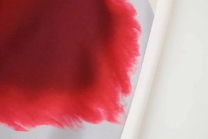 Detailed macro view of red and grey gradient silk fabric with smooth woven texture